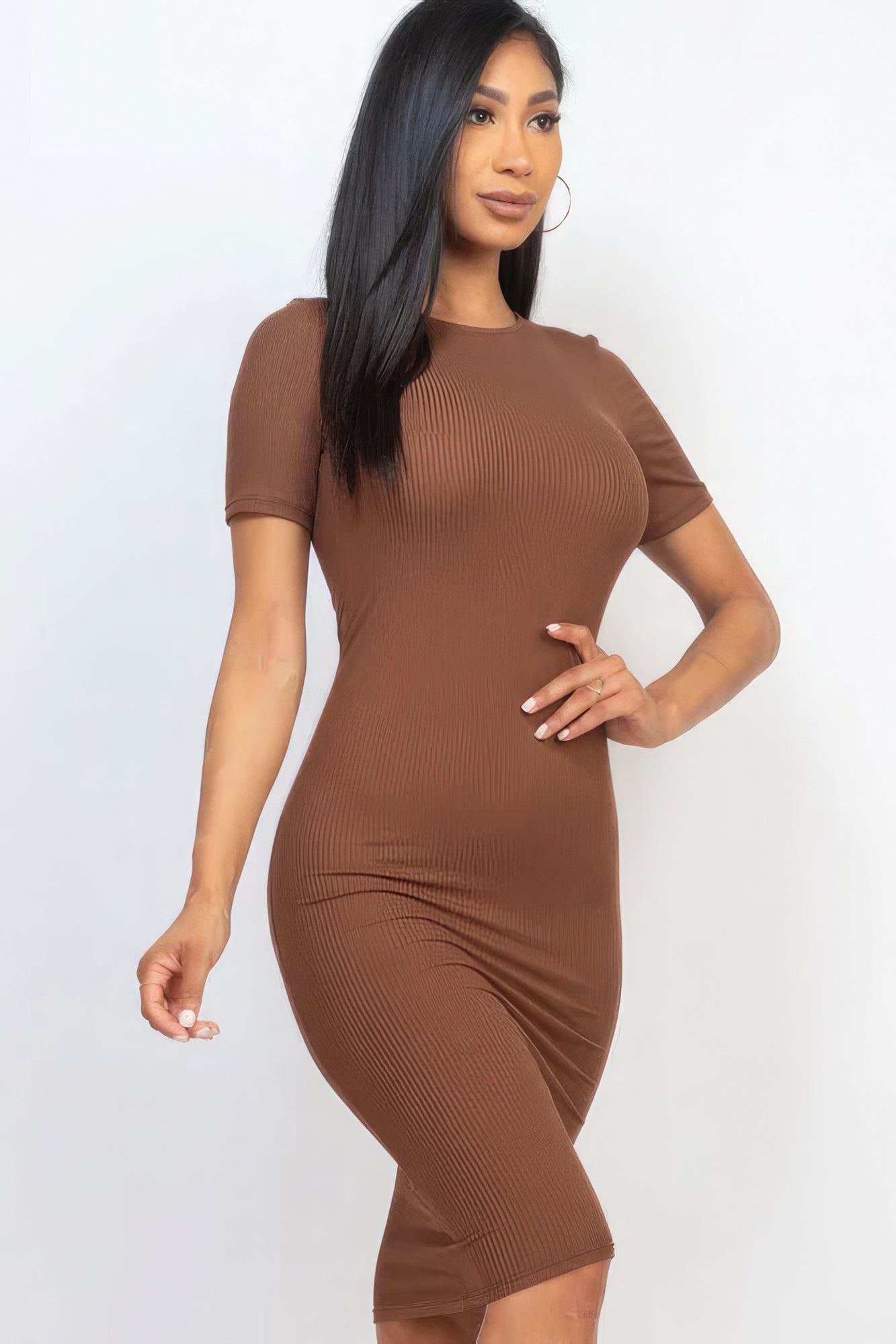 Introducing The Sarah, a sophisticated and versatile addition to your wardrobe that seamlessly combines comfort and style. This midi dress, available in a rich downtown brown colour, is crafted from a blend of 92% Polyester and 8% Spandex, to give you a flattering silhouette. Perfect for a night out, special events, or any occasion where you want to make a statement.