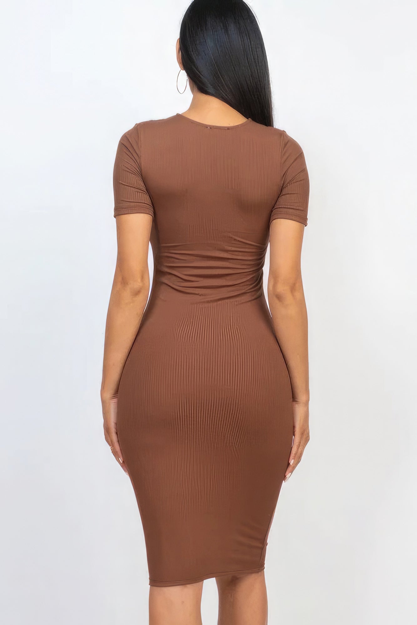 Introducing The Sarah, a sophisticated and versatile addition to your wardrobe that seamlessly combines comfort and style. This midi dress, available in a rich downtown brown colour, is crafted from a blend of 92% Polyester and 8% Spandex, to give you a flattering silhouette. Perfect for a night out, special events, or any occasion where you want to make a statement.