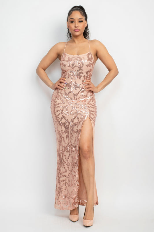 The Savannah is a glamorous addition to your wardrobe. This classic couture dress in Rose Gold is perfect for making a statement at any special occasion. Crafted from a luxurious blend of 90% polyester and 10% spandex, this dress offers both comfort and stretch. The sequin-studded design, scoop neckline, and bodycon silhouette create a figure-flattering look. The back-crisscross tie detail adds an extra touch of sophistication, while the side slit and maxi-length enhance the overall allure.