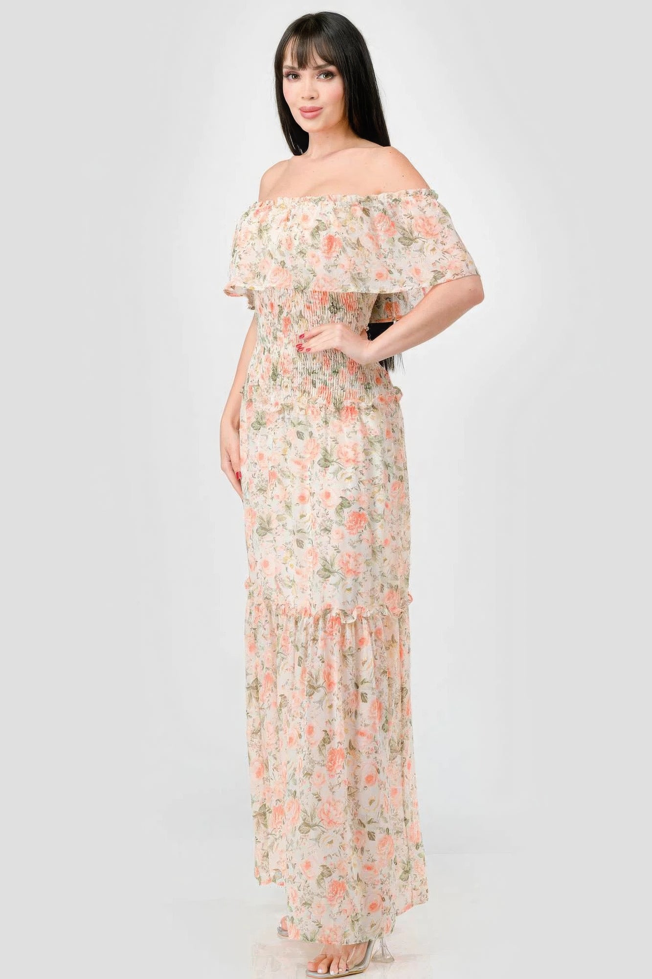 Elevate your wardrobe with The Sage, our floral chiffon maxi dress. It is a stunning piece that exudes elegance and grace. Crafted from 100% Polyester, this dress offers a lightweight and luxurious feel for all-day comfort. Made from high-quality chiffon fabric, The Sage ensures a delicate and flowy silhouette. It features an off-shoulder neckline with a smocked back and ruffled tiered detailing, offering a romantic and feminine look. Perfect for a range of occasions, from garden parties to beach weddings.