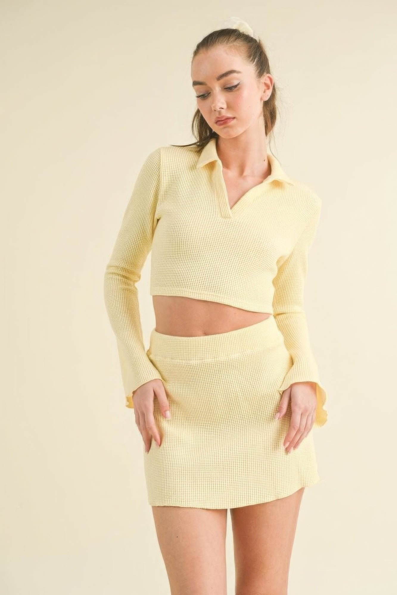 The Nyla is our waffle knit bell sleeve top and skirt set. This cute ensemble is crafted from a cozy waffle knit fabric for a stylish yet relaxed fit. Perfect for casual outings, brunch dates, or relaxed gatherings. Fabric: Made from a blend of 50% rayon, 29% polyester, and 21% nylon. Colour: yellow.