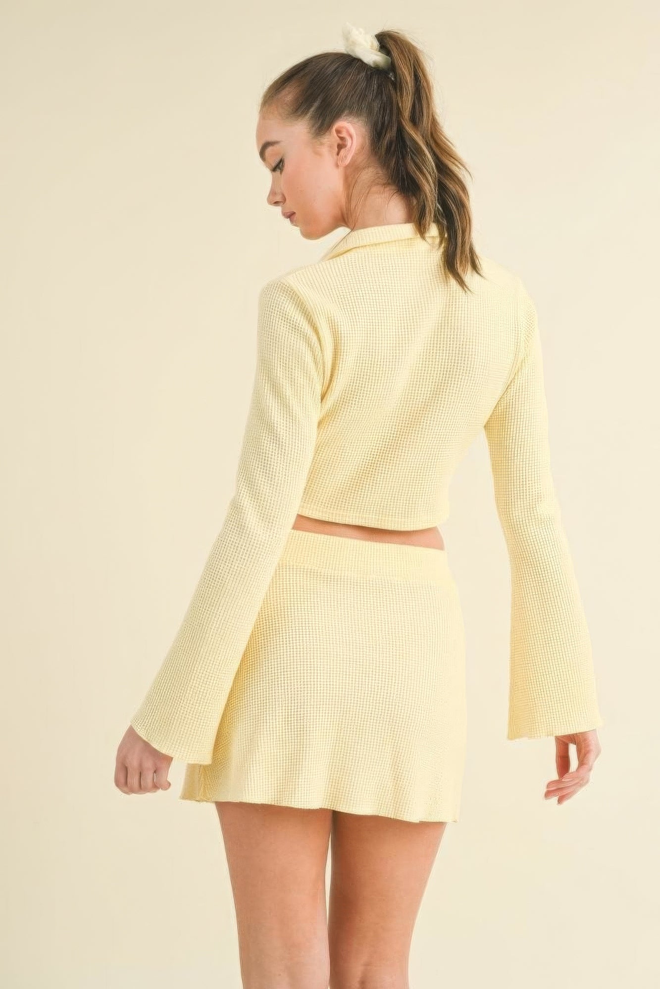 The Nyla is our waffle knit bell sleeve top and skirt set. This cute ensemble is crafted from a cozy waffle knit fabric for a stylish yet relaxed fit. Perfect for casual outings, brunch dates, or relaxed gatherings. Fabric: Made from a blend of 50% rayon, 29% polyester, and 21% nylon. Colour: yellow.