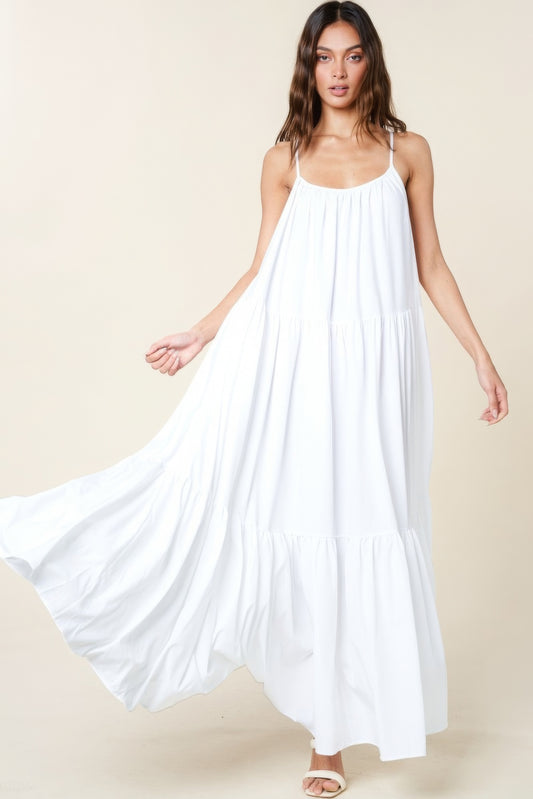 The Tessa is our maxi sun dress with pockets. It features adjustable straps and an extra-wide A-line silhouette. Perfect for beach outings, vacations, or casual gatherings. Fabric: Made from 100% polyester. Colour: white.