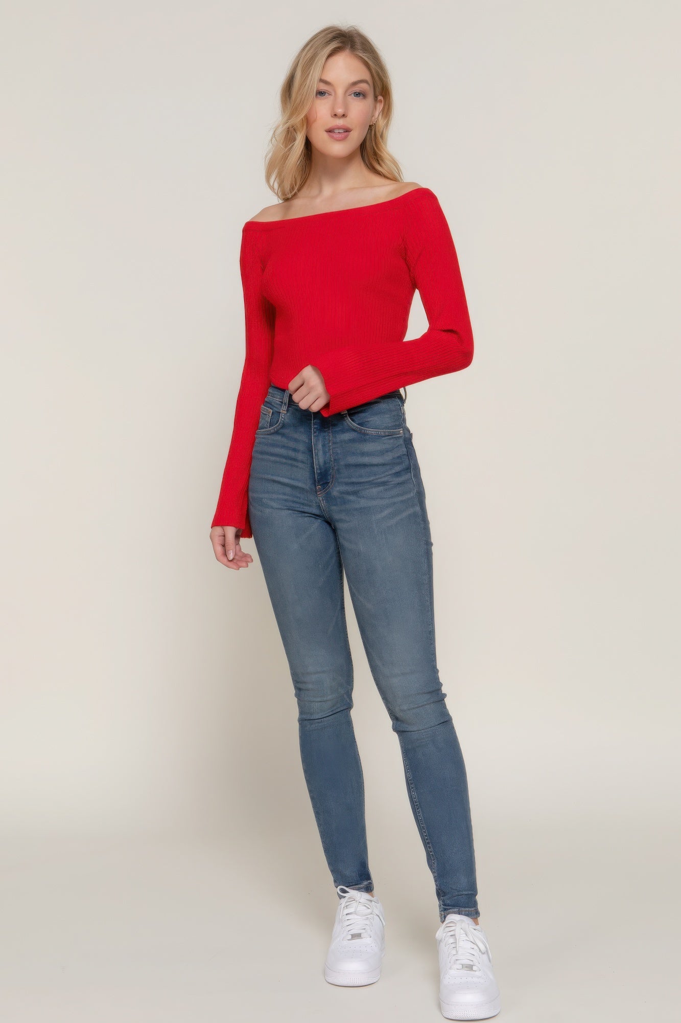 The Blair is our long flare sleeve off-shoulder sweater. This stunning piece is finished with a corset hem for a tailored look. Perfect for evening outings, casual events, or any occasion where you want to showcase an elegant look. Fabric: Made from 49% viscose, 28% polyester, and 23% nylon. Colour: red.