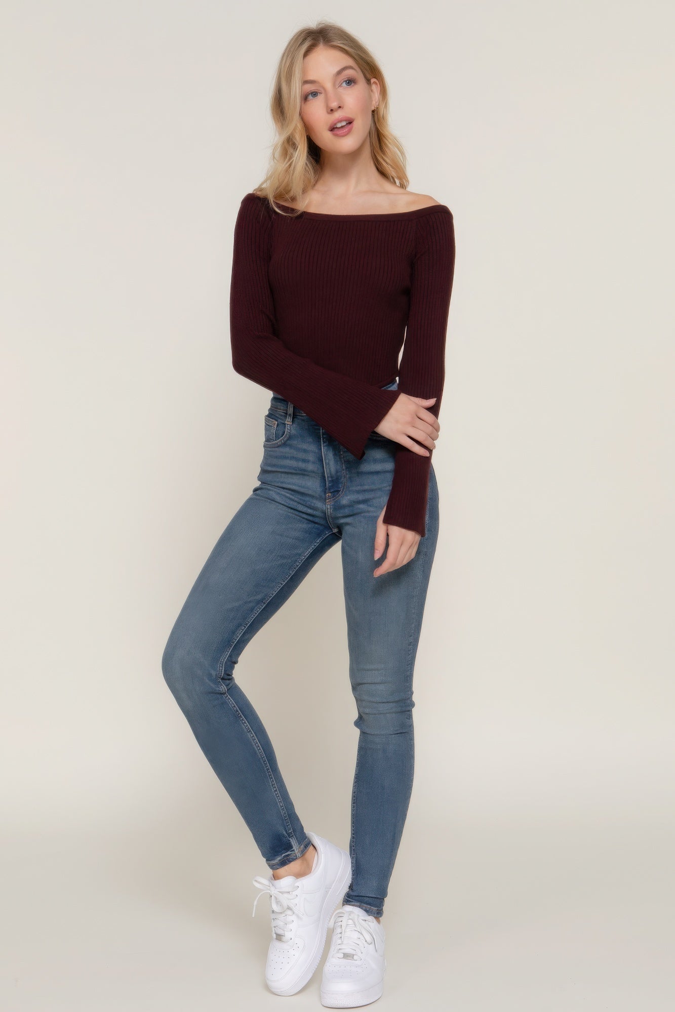 The Blair is our long flare sleeve off-shoulder sweater. This stunning piece is finished with a corset hem for a tailored look. Perfect for evening outings, casual events, or any occasion where you want to showcase an elegant look. Fabric: Made from 49% viscose, 28% polyester, and 23% nylon. Colour: maroon.