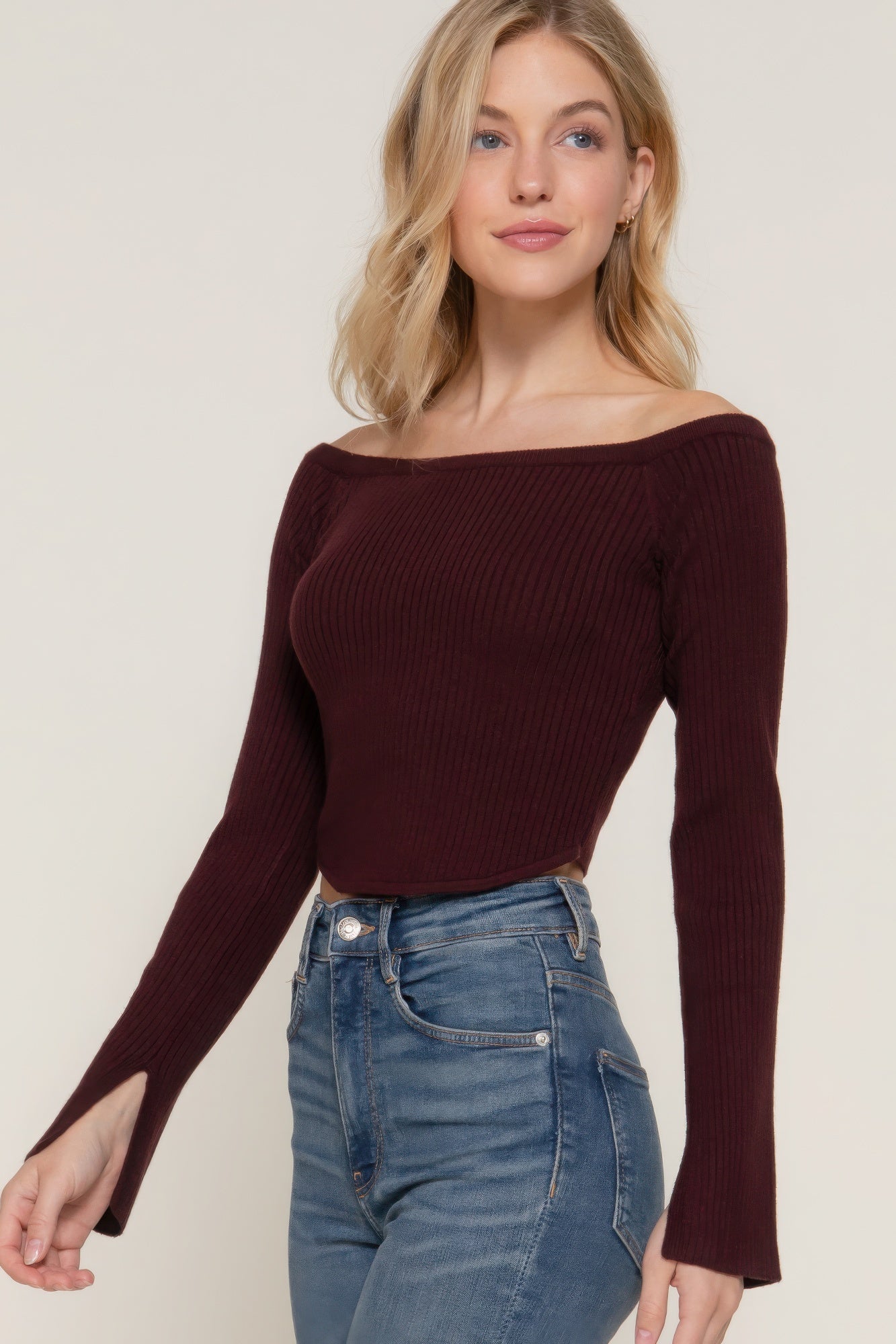 The Blair is our long flare sleeve off-shoulder sweater. This stunning piece is finished with a corset hem for a tailored look. Perfect for evening outings, casual events, or any occasion where you want to showcase an elegant look. Fabric: Made from 49% viscose, 28% polyester, and 23% nylon. Colour: maroon.