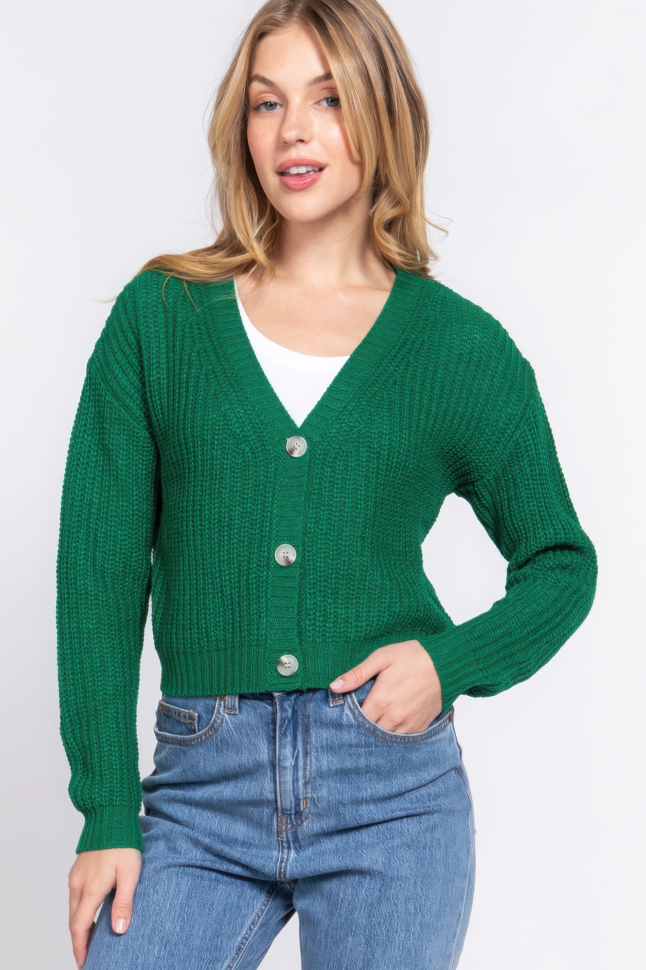 The Kate is our long sleeve v-neck cardigan. It's stylish and versatile piece with a button-down front and a relaxed fit. Ideal for layering over tops and dresses. Perfect for casual outings on cooler days. Fabric: 100% acrylic. Colour: green.