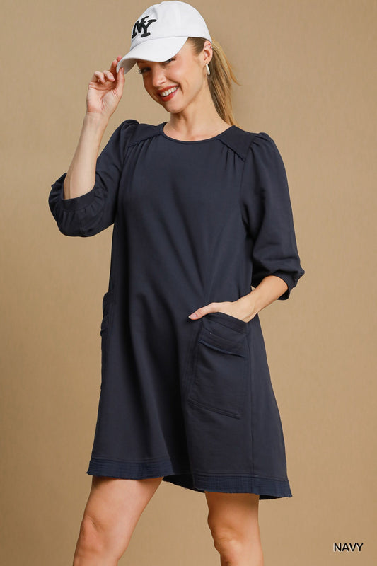 The Terry is a mini dress crafted from soft French Terry fabric. It offers a perfect blend of comfort and style. It features double pockets, frayed trim details and a relaxed fit. The dress is not lined making it lightweight and ideal for layering. Fabric: 100% cotton. Colour: navy.