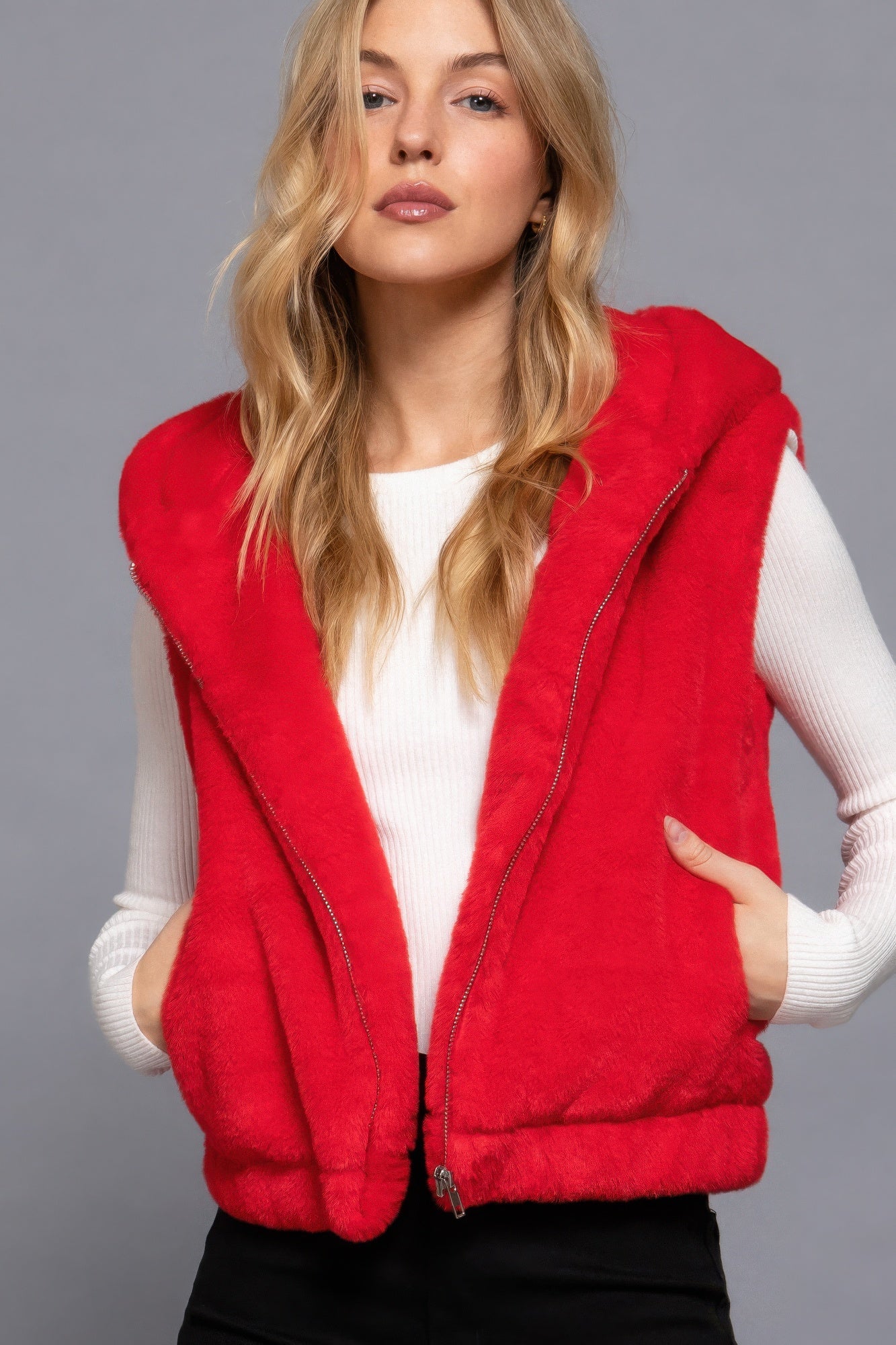 The Rory is our hooded faux fur vest that is perfect for Autumn and Winter. Ideal for layering over your favourite tops or sweaters. Perfect for casual outings on chilly days and as a stylish addition to your everyday wear. Fabric: 100% Polyester; faux fur. Colour: red.