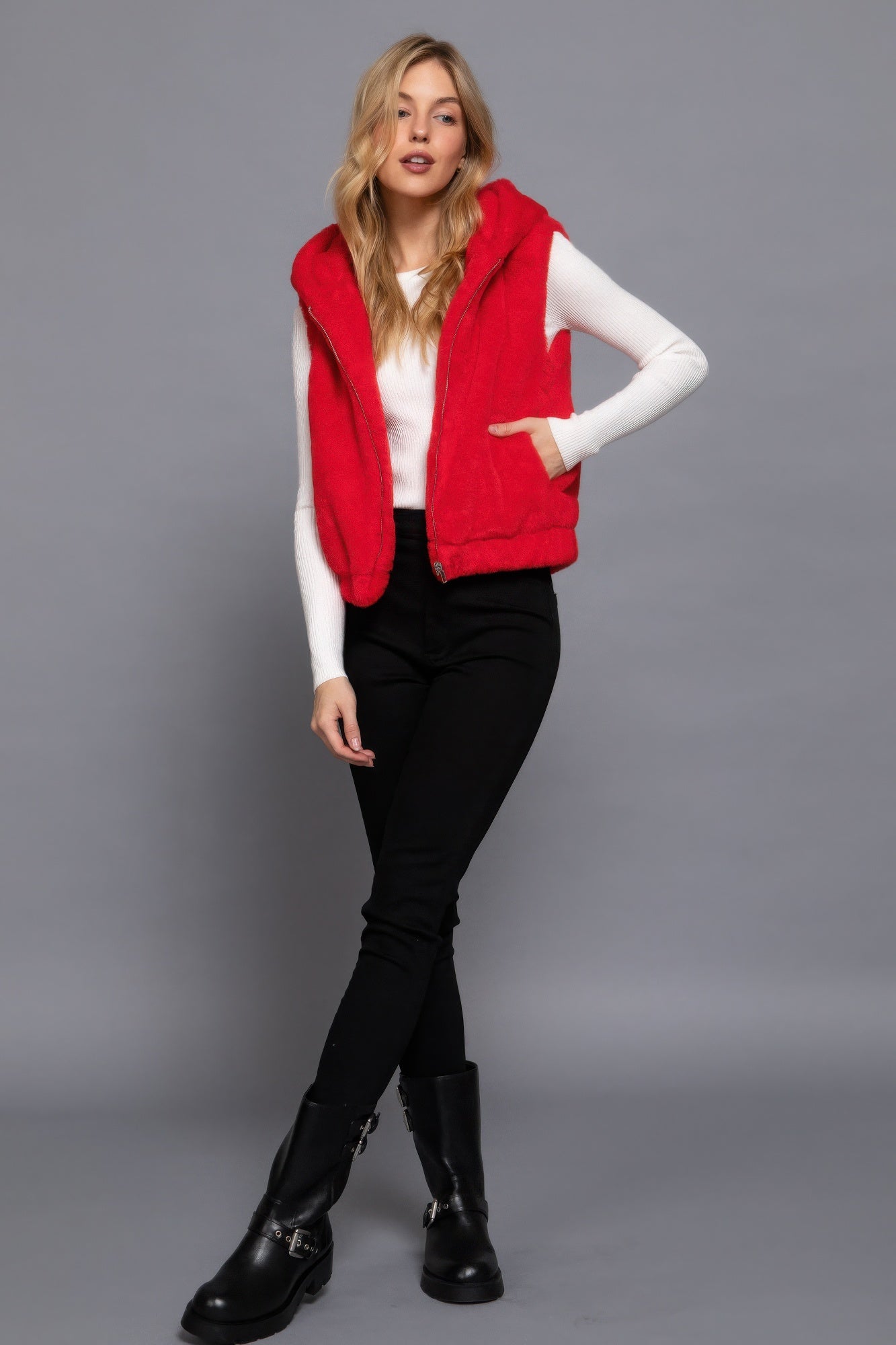 The Rory is our hooded faux fur vest that is perfect for Autumn and Winter. Ideal for layering over your favourite tops or sweaters. Perfect for casual outings on chilly days and as a stylish addition to your everyday wear. Fabric: 100% Polyester; faux fur. Colour: red.