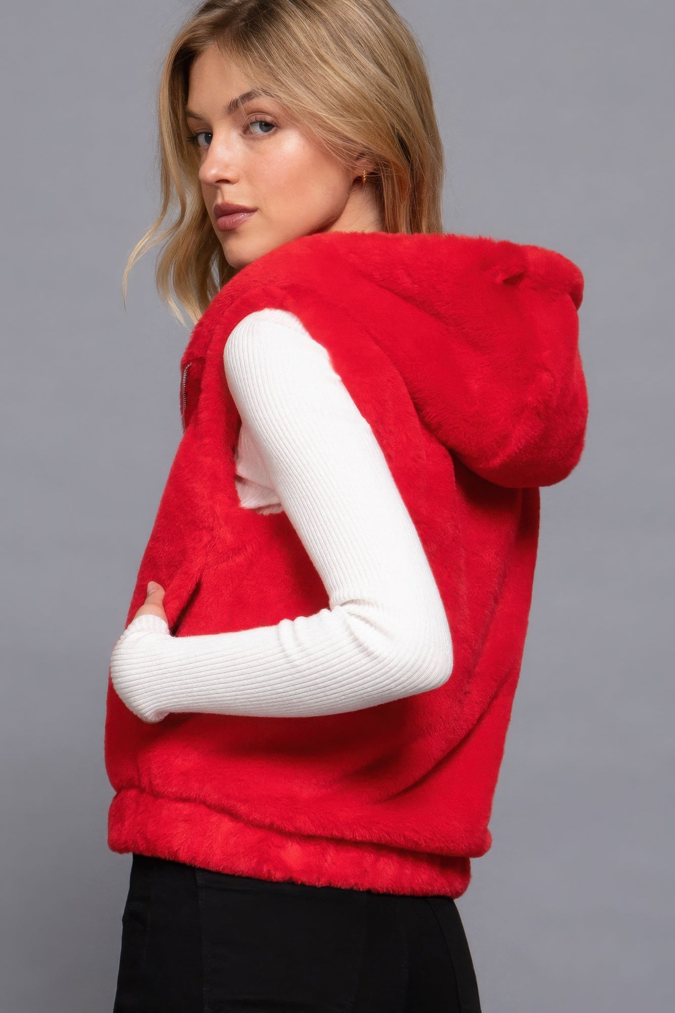 The Rory is our hooded faux fur vest that is perfect for Autumn and Winter. Ideal for layering over your favourite tops or sweaters. Perfect for casual outings on chilly days and as a stylish addition to your everyday wear. Fabric: 100% Polyester; faux fur. Colour: red.