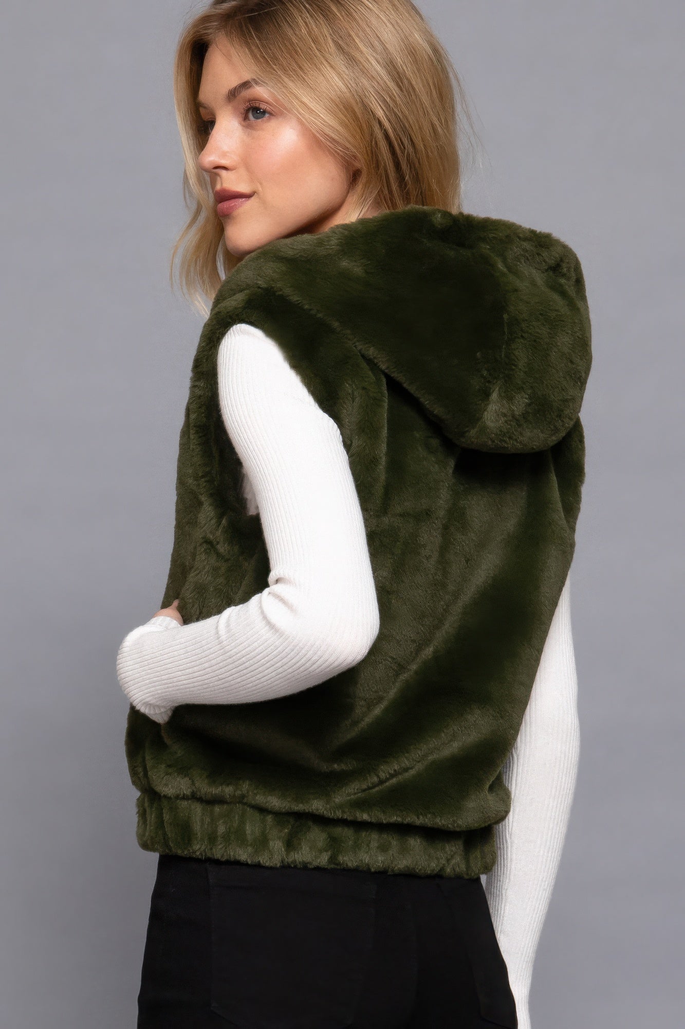 The Rory is our hooded faux fur vest that is perfect for Autumn and Winter. Ideal for layering over your favourite tops or sweaters. Perfect for casual outings on chilly days and as a stylish addition to your everyday wear. Fabric: 100% Polyester; faux fur. Colour: olive green.