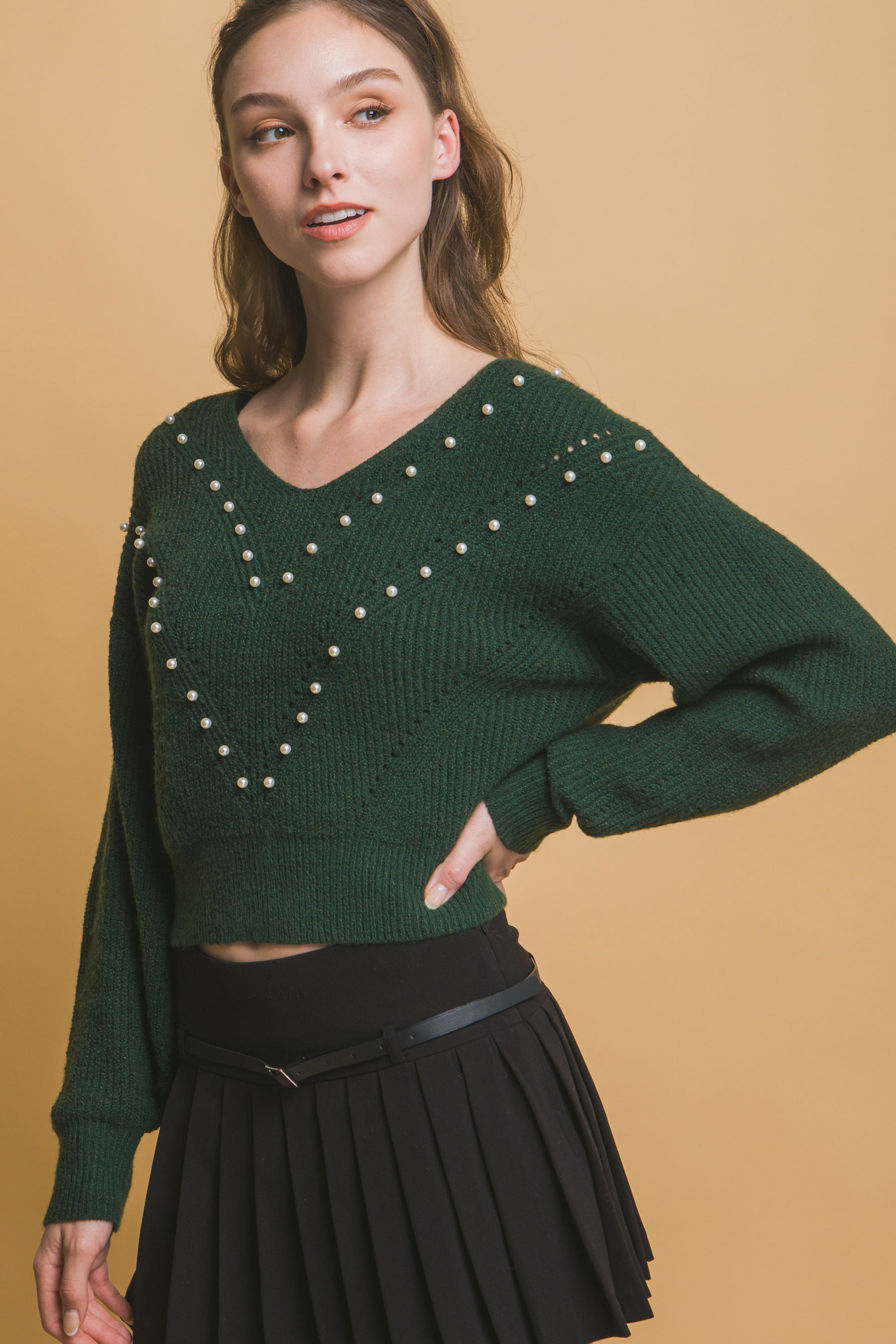 The Pearl is a luxurious and stylish piece that combines elegance with comfort. Crafted with a blend of high-quality materials, this sweater features an exquisite pearl detailing for a more sophisticated look. Designed for a comfortable and flattering fit and perfect for all-day wear. Fabric: Made from 89% polyester, 8% nylon, and 3% spandex. Colour: Hunter Green.