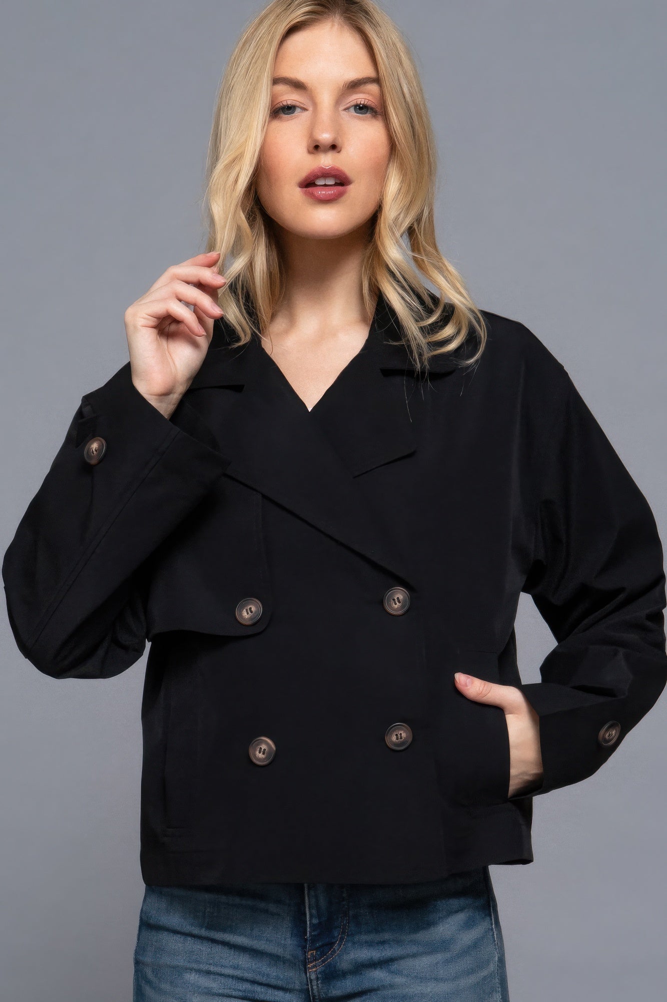 The Julia is our double breasted short trench jacket, a stylish choice for both casual and formal occasions. Each jacket is expertly stitched to ensure durability and a quality finish. Perfect for layering over dresses or tailored outfits, this jacket can seamlessly transition from day to night. Fabric: 100% polyester. Colour: black.