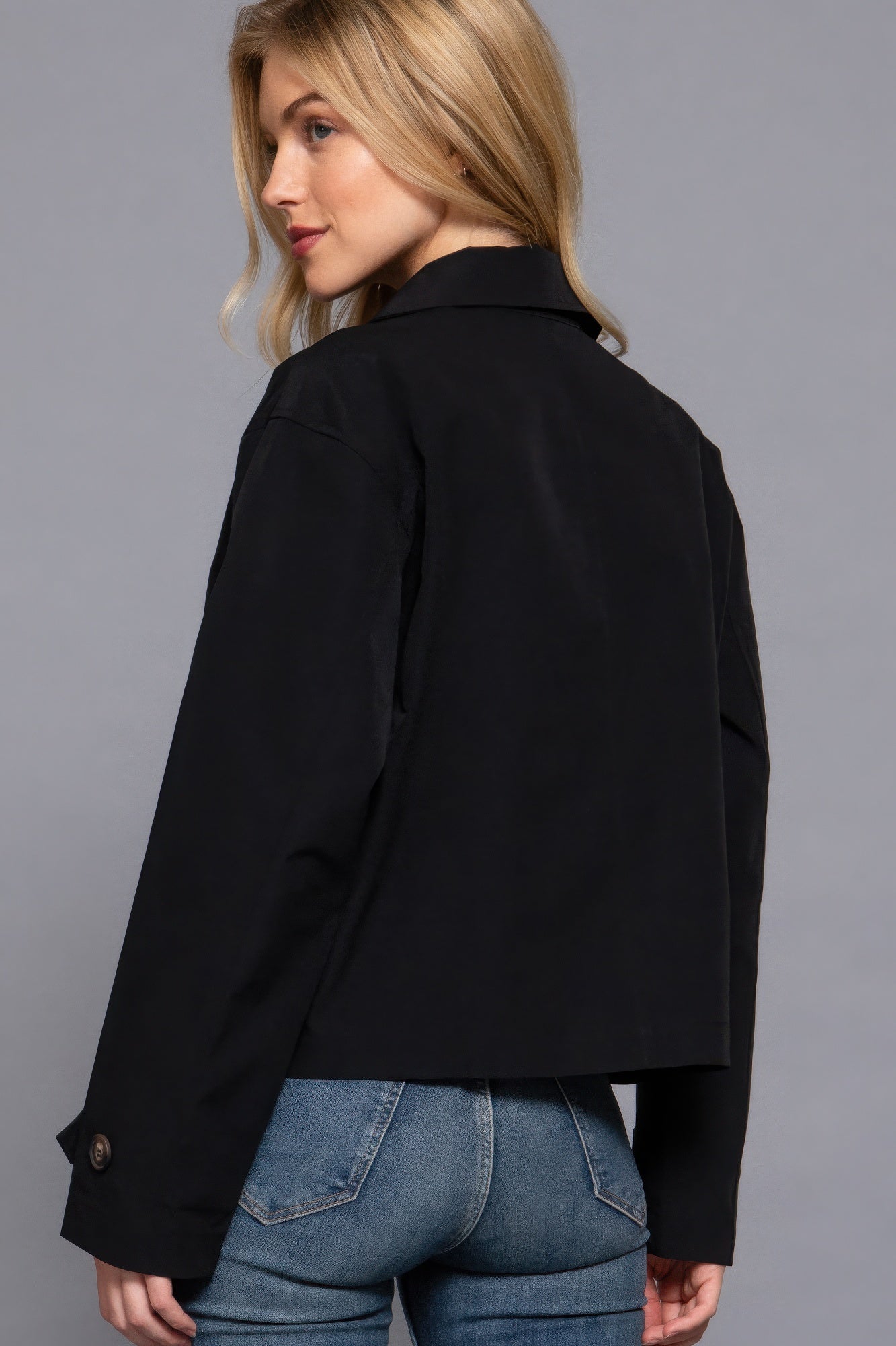 The Julia is our double breasted short trench jacket, a stylish choice for both casual and formal occasions. Each jacket is expertly stitched to ensure durability and a quality finish. Perfect for layering over dresses or tailored outfits, this jacket can seamlessly transition from day to night. Fabric: 100% polyester. Colour: black.