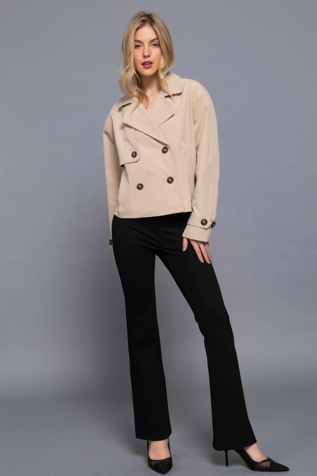 The Julia is our double breasted short trench jacket, a stylish choice for both casual and formal occasions. Each jacket is expertly stitched to ensure durability and a quality finish. Perfect for layering over dresses or tailored outfits, this jacket can seamlessly transition from day to night. Fabric: 100% polyester. Colour: beige.