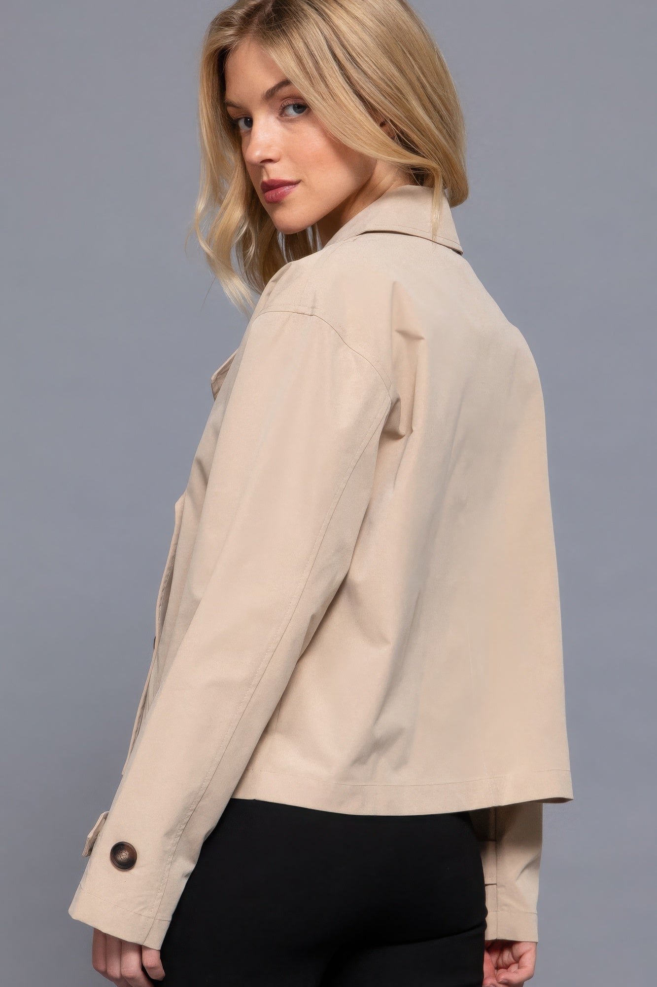 The Julia is our double breasted short trench jacket, a stylish choice for both casual and formal occasions. Each jacket is expertly stitched to ensure durability and a quality finish. Perfect for layering over dresses or tailored outfits, this jacket can seamlessly transition from day to night. Fabric: 100% polyester. Colour: beige.