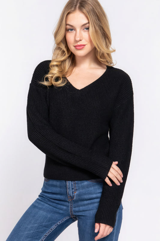 Introducing The Faye; a trendy and cozy sweater that seamlessly combines comfort with a touch of flair. This sweater features dolman long sleeves, a V-neck with strappy details, and an open back for a versatile and stylish look. Material: Crafted from a blend of 90% Acrylic and 10% Nylon. Black Top.