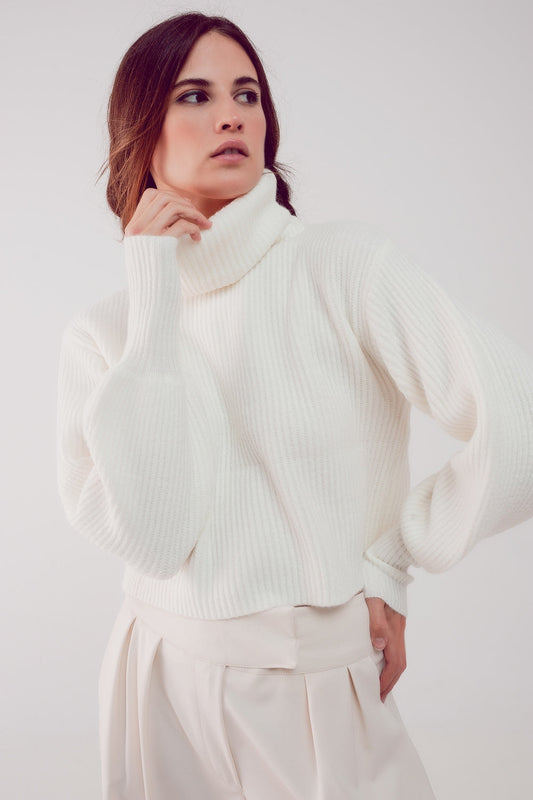 The White Winter Turtleneck Sweater is a must-have. This sweater boasts a cozy chunky knit fabric and stylish puff sleeves, blending comfort and fashion effortlessly. It's made from a blend of 45% Acrylic, 28% Polyamide, and 27% Polyester. With a standard fit that runs true to size, this sweater is designed to provide a comfortable and stylish look. Embrace the perfect combination of comfort and chic style.