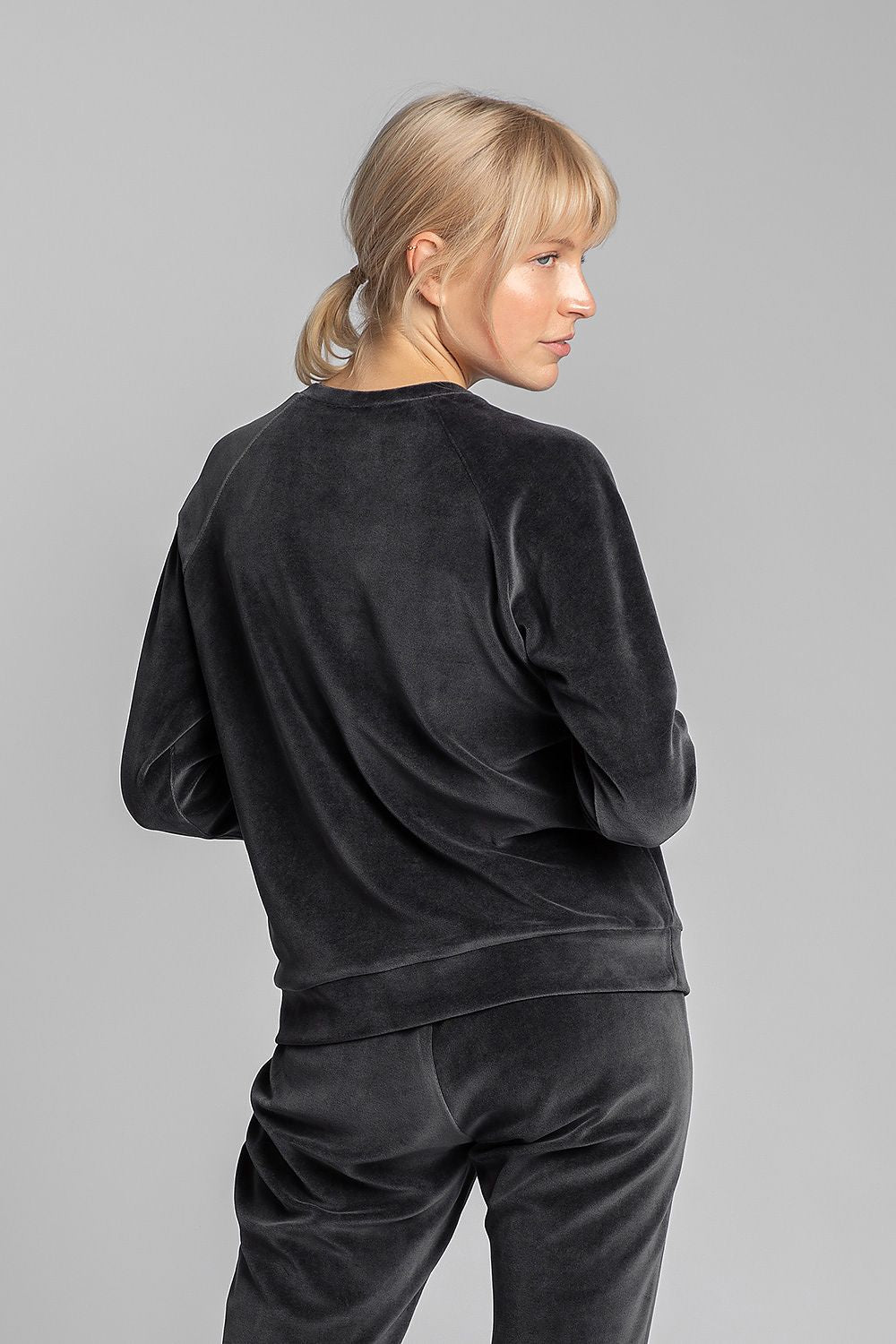 Unique dark grey velour sweatshirt with cuffed sleeves and decorative wolf embroidery on the chest.