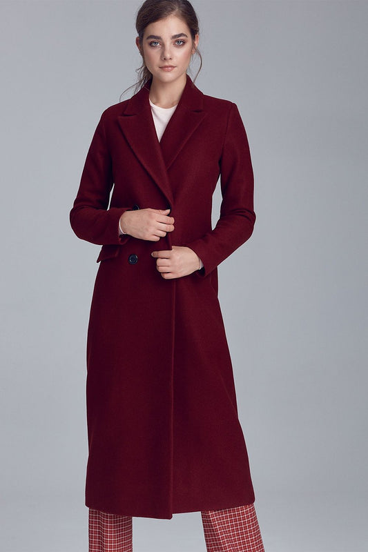 The Dahlia is an elegant, warm, long red coat made of soft material with a touch of wool. A perfect complement to autumn and winter. Simple, timeless cut will suit both official and casual outfits. Double-breasted fastening, classic collar and pockets.